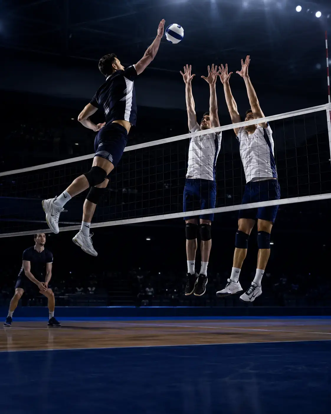 Custom volleyball team uniform during overhead play