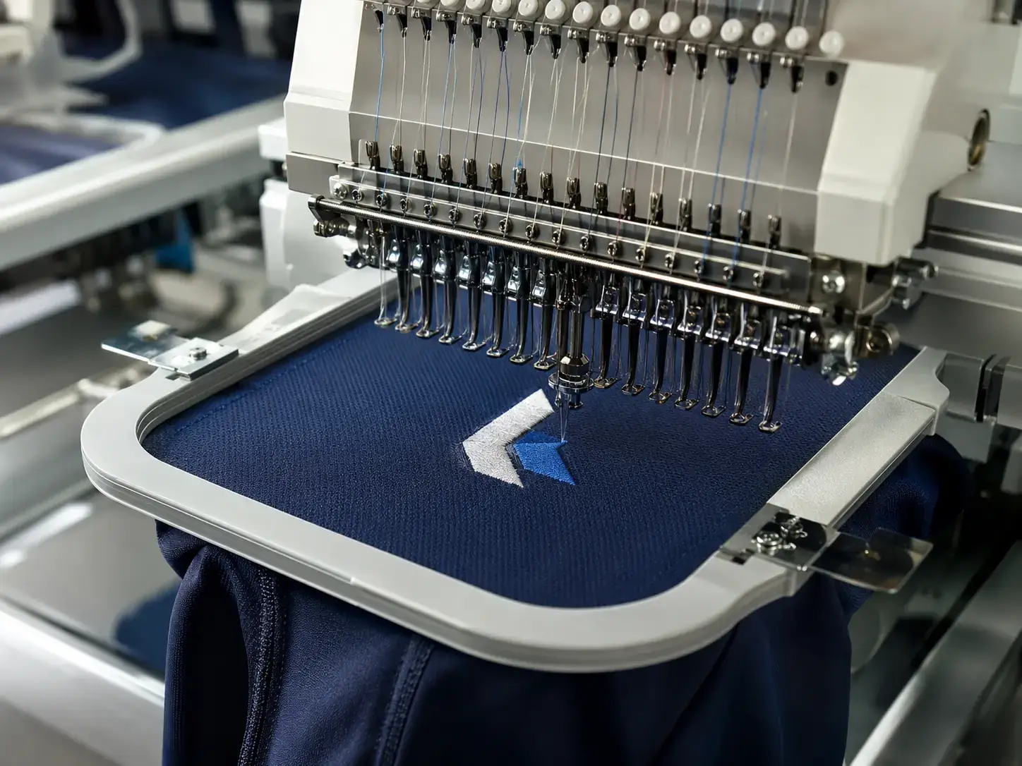 Embroidered sportswear logo produced on professional machinery