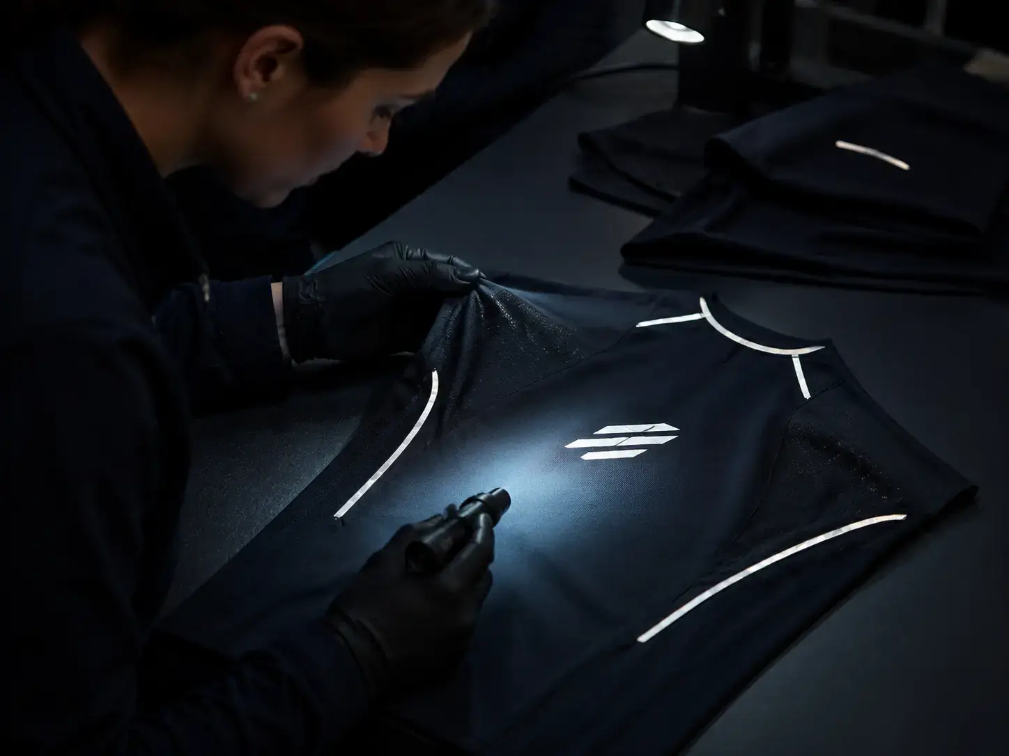 Reflective activewear application inspected under directional light